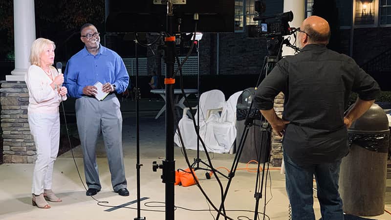 A cameraman shooting video of WRAL new anchor and reporter Ken Smith.