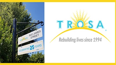 Logo and photo of the street sign for TROSA in Durham, North Carolina.